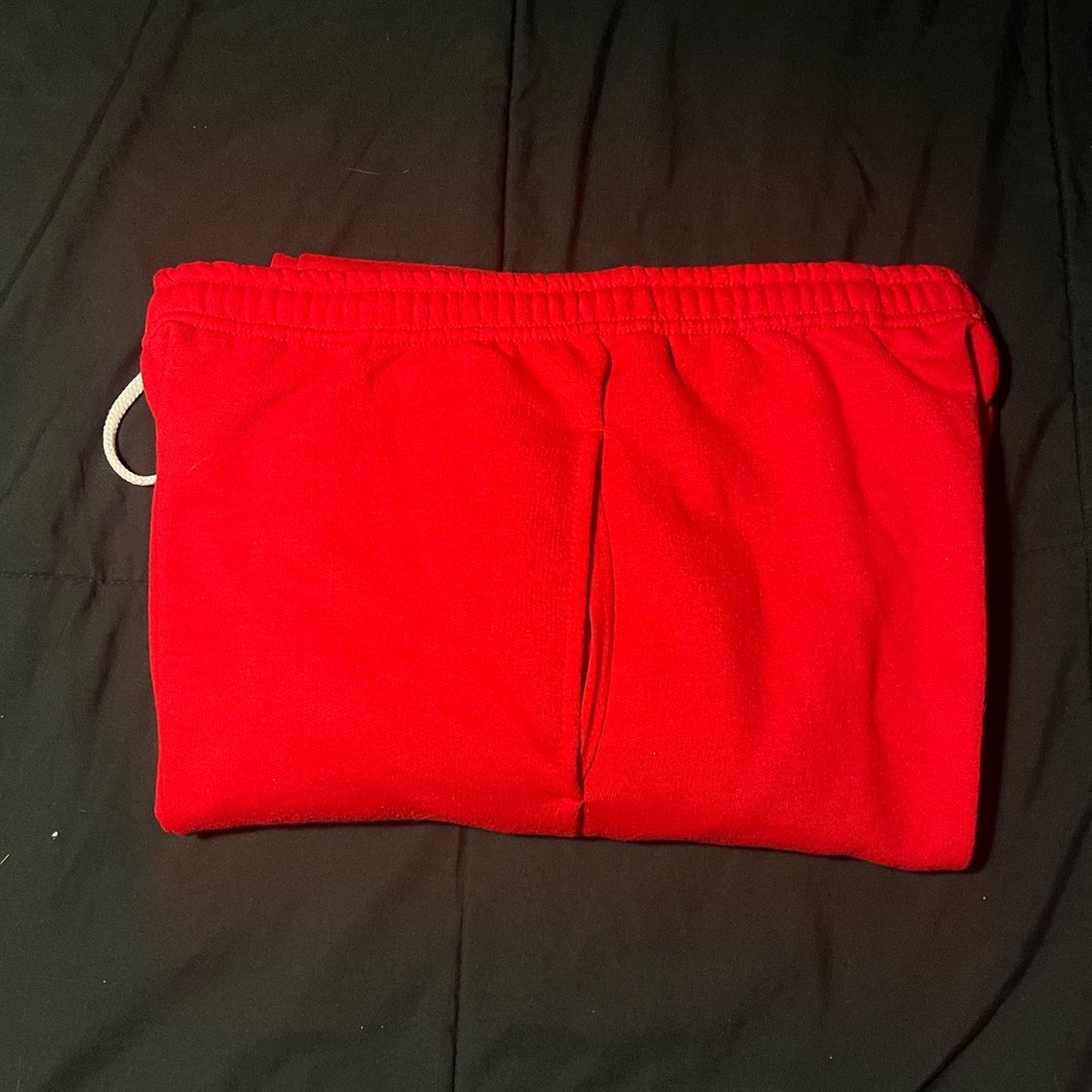 Red sweatpants with adjustable waistband